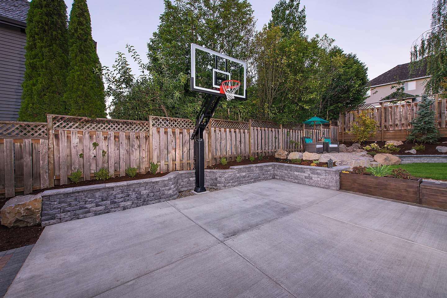 backyard-basketball-court-with-hardscaping-wood-planters-lighting-DeShayes-Dream-Courts